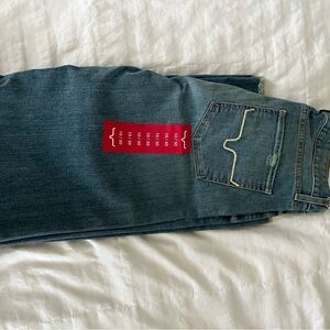 Kim’s Ranch (Olive) Classic Wide-Leg Blue Jeans with fringe hem